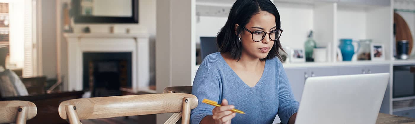 single female at home reviewing her divorce finances
