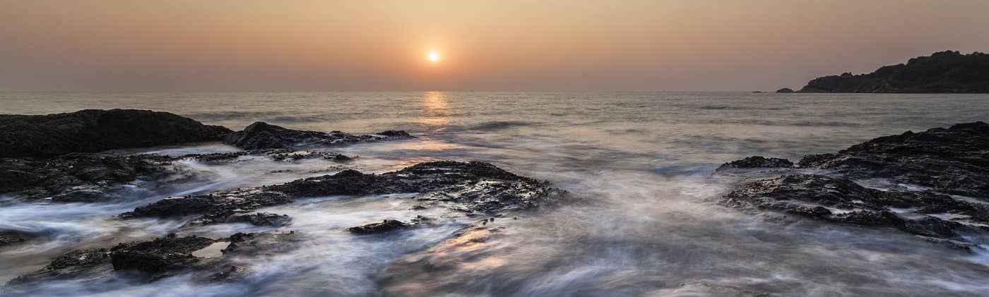 waves crashing at sunset