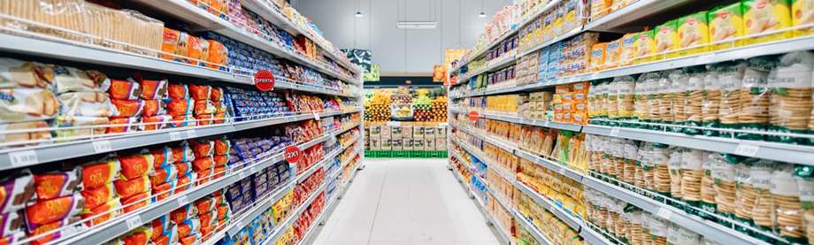 Grocery cart in grocery aisle