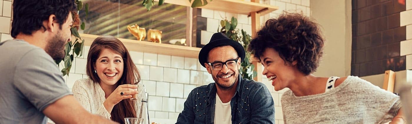 two 30 something couples have coffee in a cafe budgeting tips