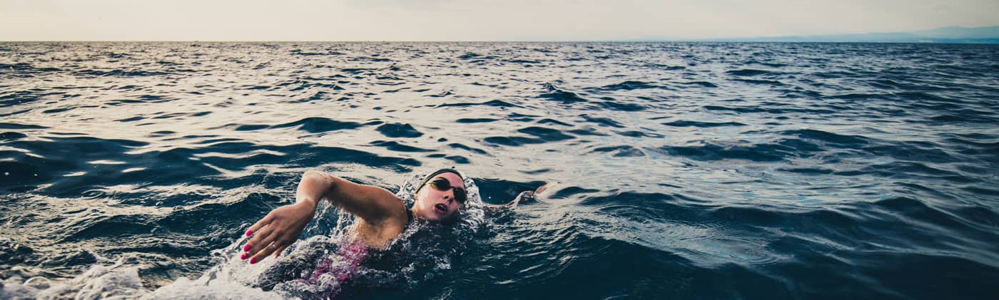 open water swimmer swimming in sea image