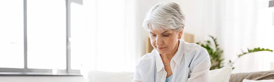 Woman deciding what a budget looks like and writing it down