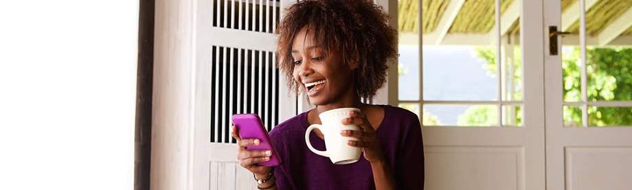 Woman researching apps on her smartphone for personal financial planning.