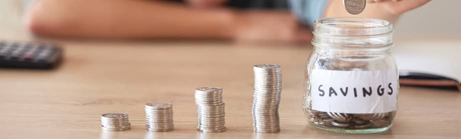A women is counting nickels to start saving for retirement.