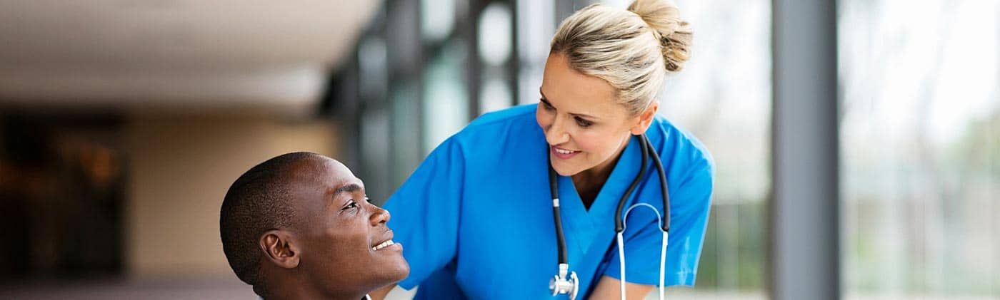 Young patient with a health care professional: critical illness insurance
