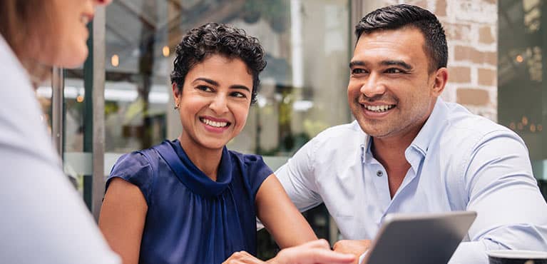 Couple talking with an advisor