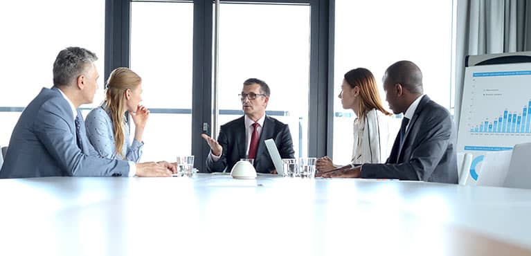 Business presentation with bar chart on easel