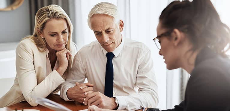 Older couple meeting with financial advisor