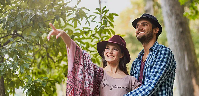 Young adults enjoying a vacation wonder, "How much do I need to retire at 45?"