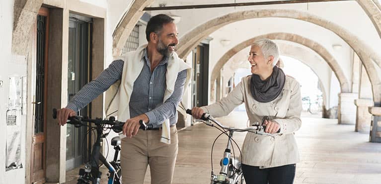 A couple enjoying their day on their bikes