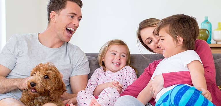 The whole family on the couch enjoying some quality time