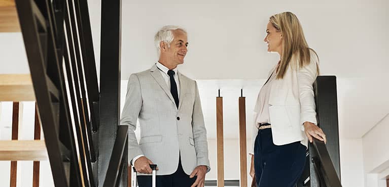 mature businessman consults with lafayette life representative to learn about saving for retirement