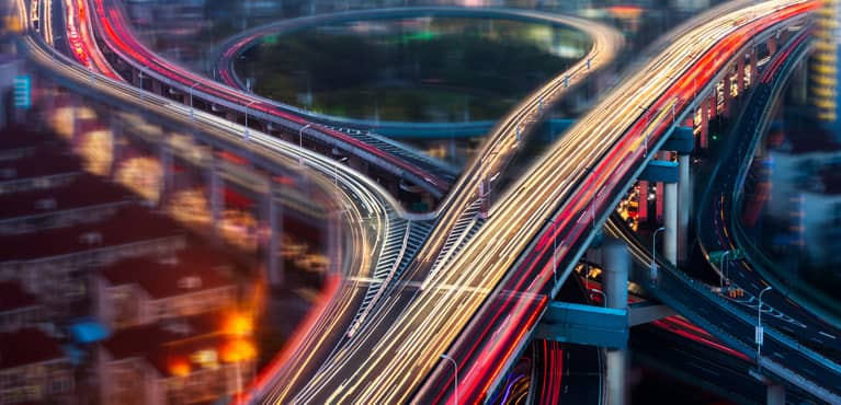 cars on highway overpass at night