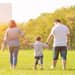 Family of three walks together and discusses why life insurance is important
