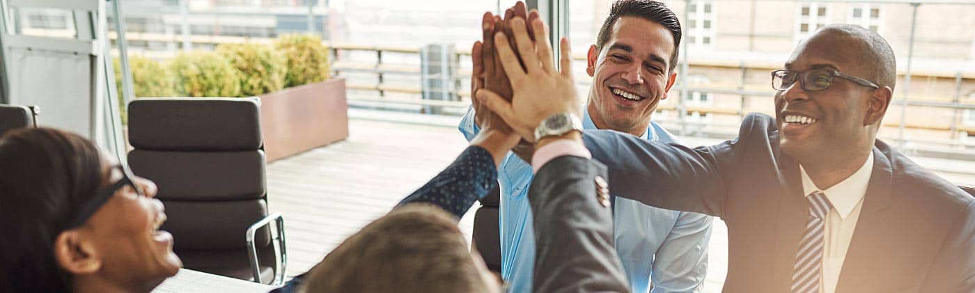 Employees celebrating completing a project