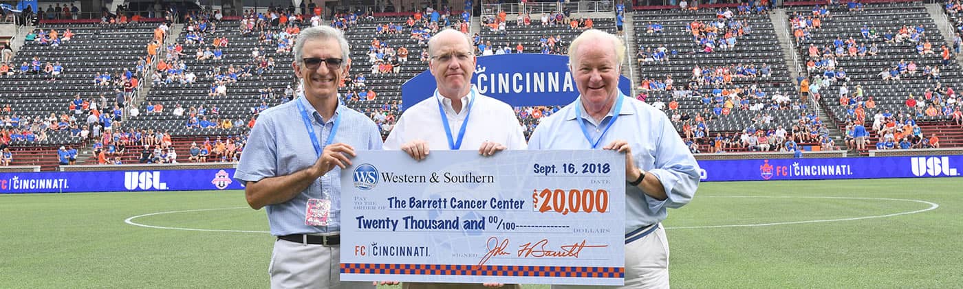 john f barrett presenting check to barrett cancer center