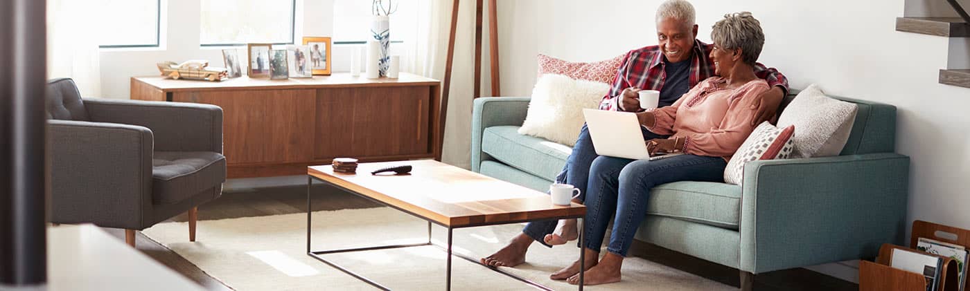 Happy couple sitting on couch