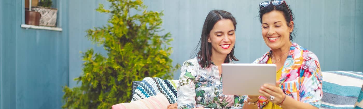 Mother and daughter sharing a screen