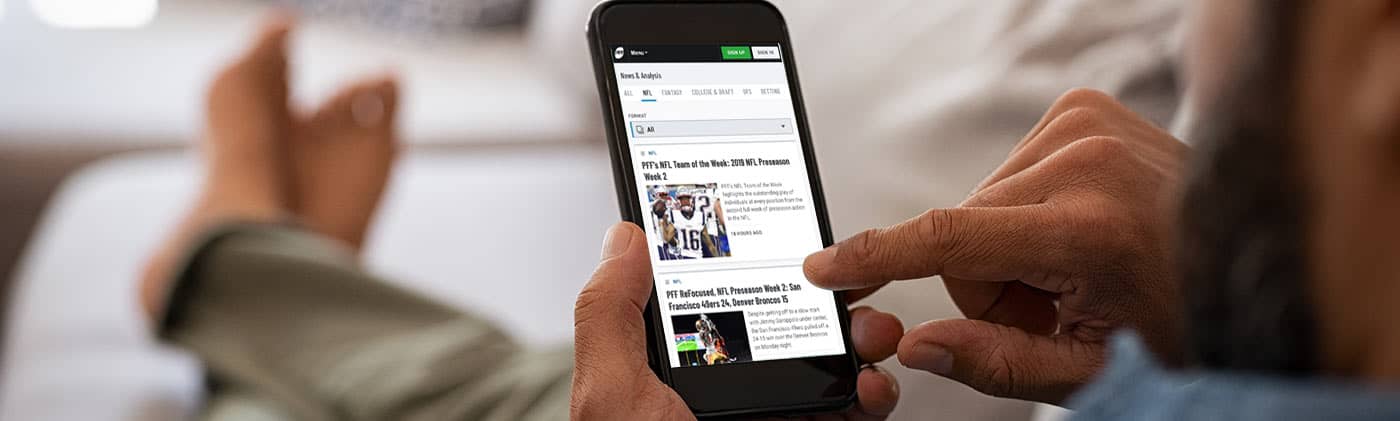 Man looking at PFF app on cell phone