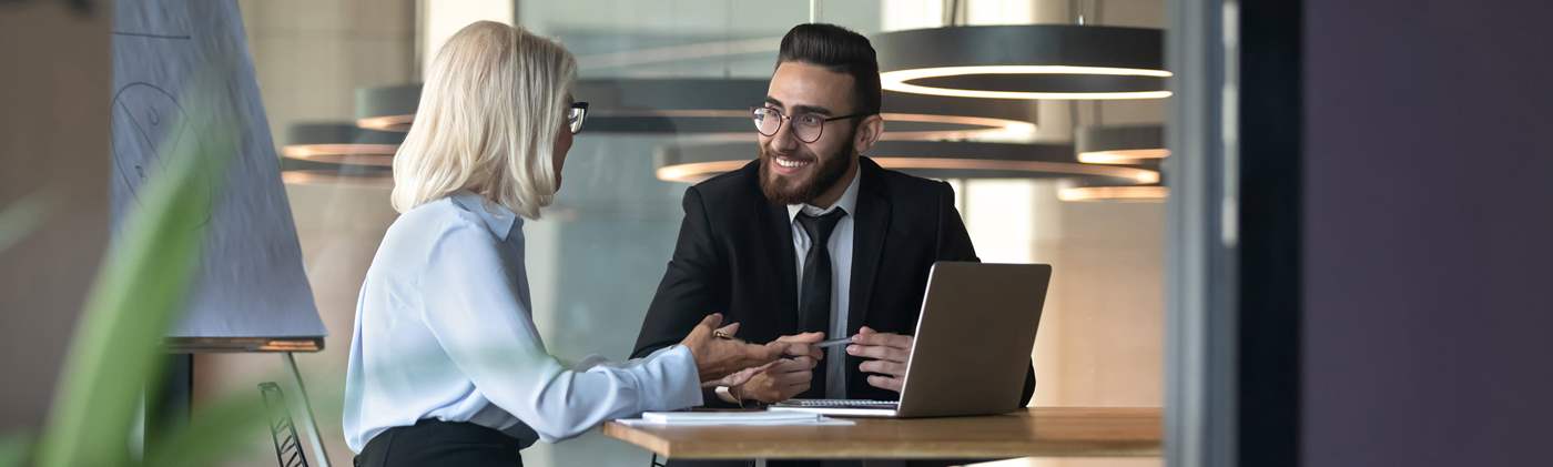 Professional man and woman in office