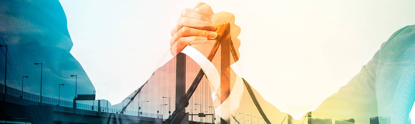 Professionals with hands clasped