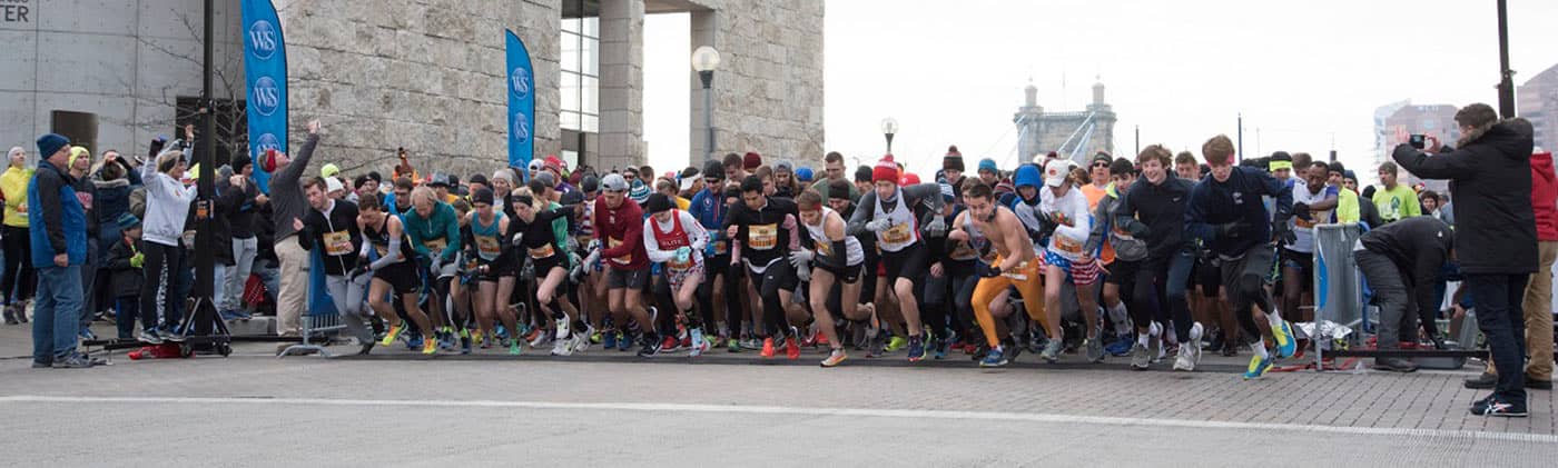 Thanksgiving Day Race runners taking off