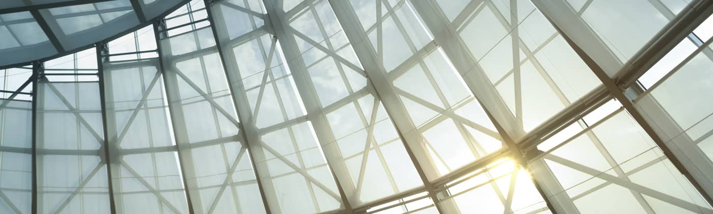 sun shining through skyscraper