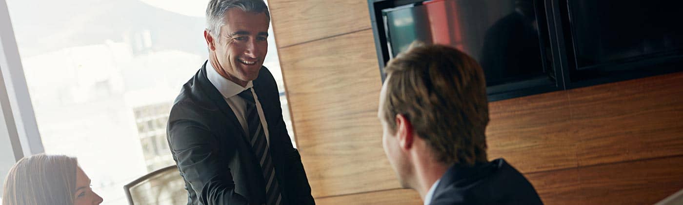 Two business professionals agreeing on a deal