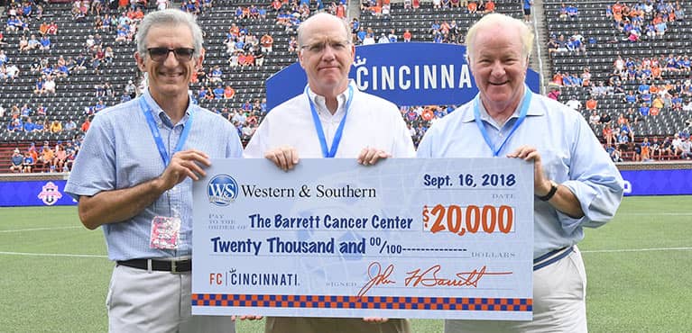 john f barrett presenting check to barrett cancer center