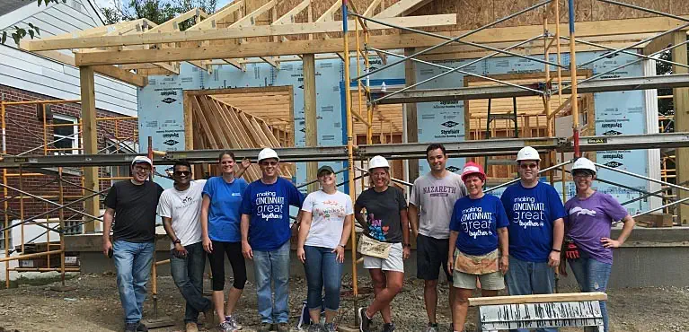 Associates building house for Habitat for Humanity