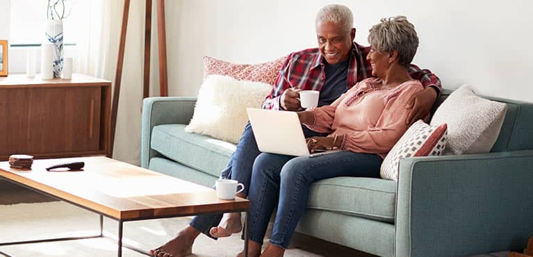Happy couple sitting on couch