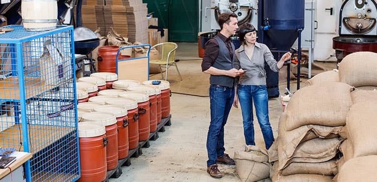 Customers of pension risk transfer working in warehouse