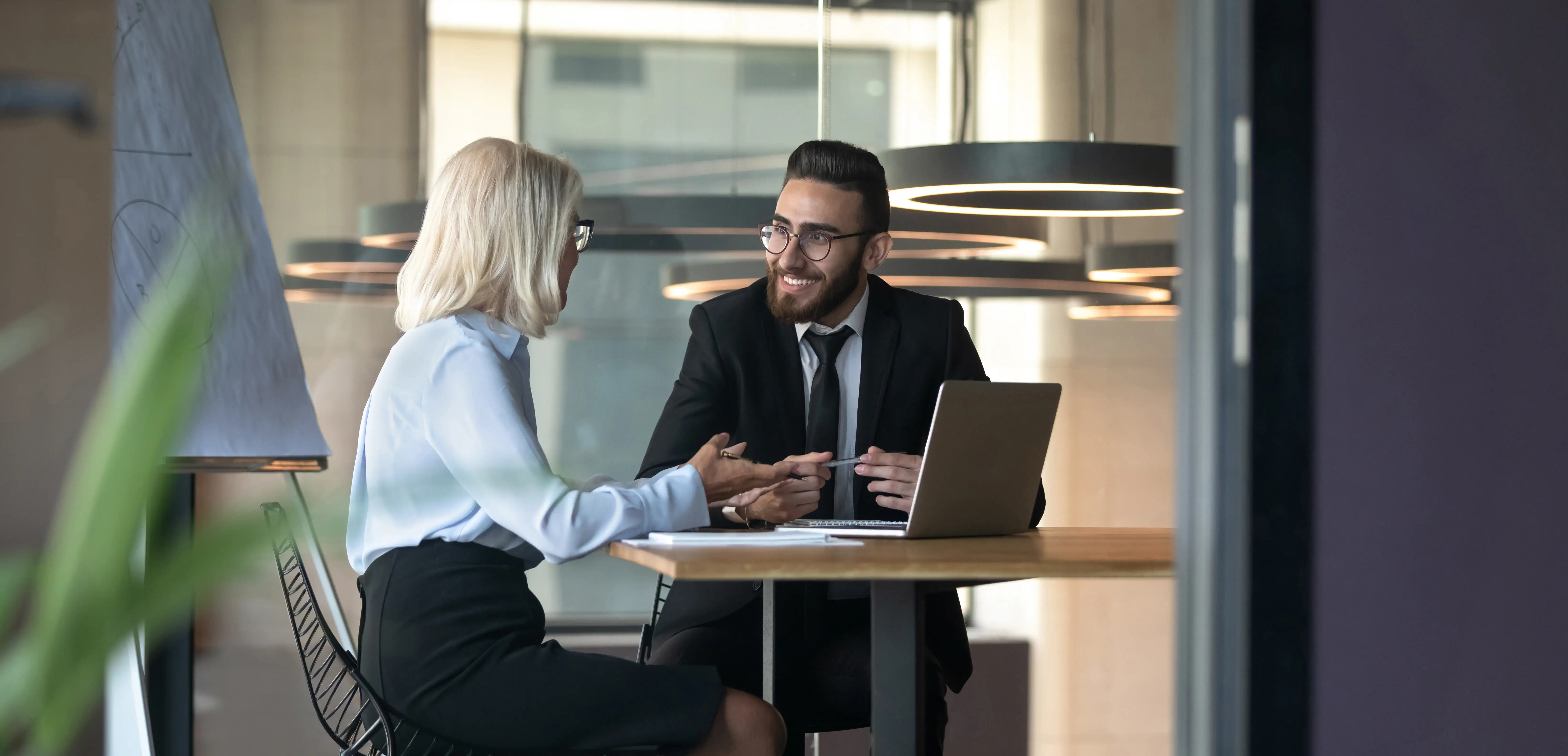 Professional man and woman in office