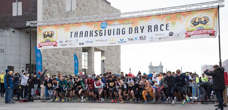 Thanksgiving Day Race runners taking off