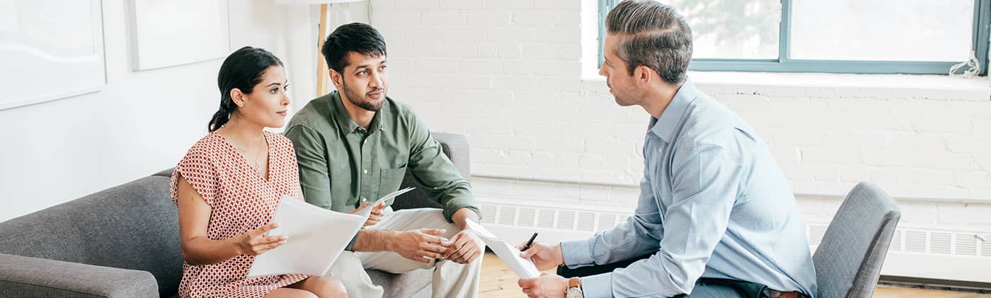 couple doing annual financial review with financial professional